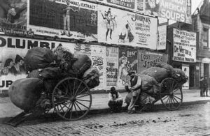 Ragmen with carts on a New York City street circa 1896