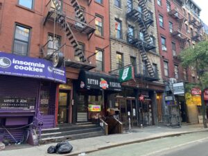 Historic storefronts and buildings on MacDougal Street in Greenwich Village