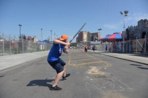 Adults playing games in a New York City asphalt playground