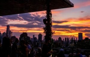 THE ROOF at PUBLIC Hotel overlooking the Manhattan skyline at sunset