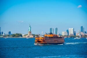 Staten Island Ferry passing the Statue of Liberty in New York Harbor