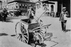 New York City White Wings street sweeper with handcart in 1896