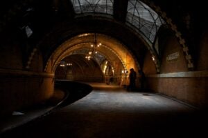 Abandoned Old City Hall subway station in New York City with curved platform and vaulted tile arches