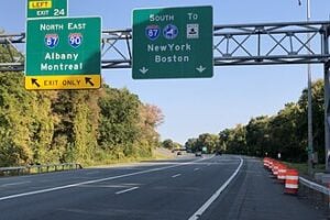 Exit 24 signs for I-90 East and I-87 North on the New York State Thruway in Albany