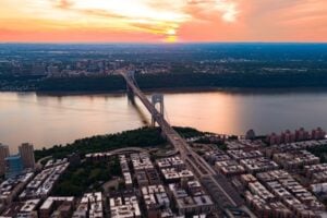 Aerial view of the George Washington Bridge crossing the Hudson River between New York and New Jersey at sunset
