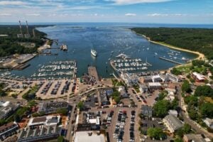 Aerial view of Port Jefferson Harbor, marinas, village streets, and Long Island Sound in Brookhaven, New York