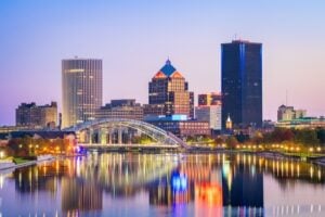 Rochester, New York skyline reflected in the Genesee River at dawn
