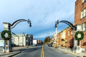 Little Italy gateway and historic brick buildings along a street in Schenectady, New York