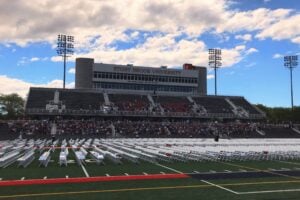 Stony Brook University stadium on Long Island with rows of chairs set up for a graduation ceremony.