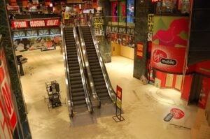 Interior of a Virgin Megastore during its closing sale with empty floors and store closing signs