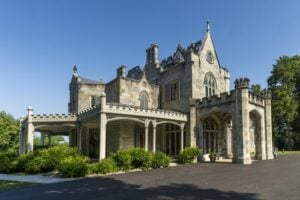 Lyndhurst Mansion in Tarrytown, New York, showing its Gothic Revival stone architecture, distinctive towers, and surrounding lawn.