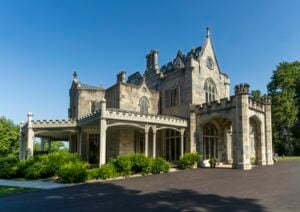 Lyndhurst Mansion in Tarrytown, New York, showing its Gothic Revival stone architecture, distinctive towers, and surrounding lawn.