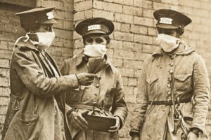 Three New York City streetcar conductors wearing protective masks during the 1918 influenza epidemic