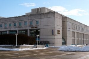 Exterior of the Science Library at the University at Albany, New York, with snow outside the building.